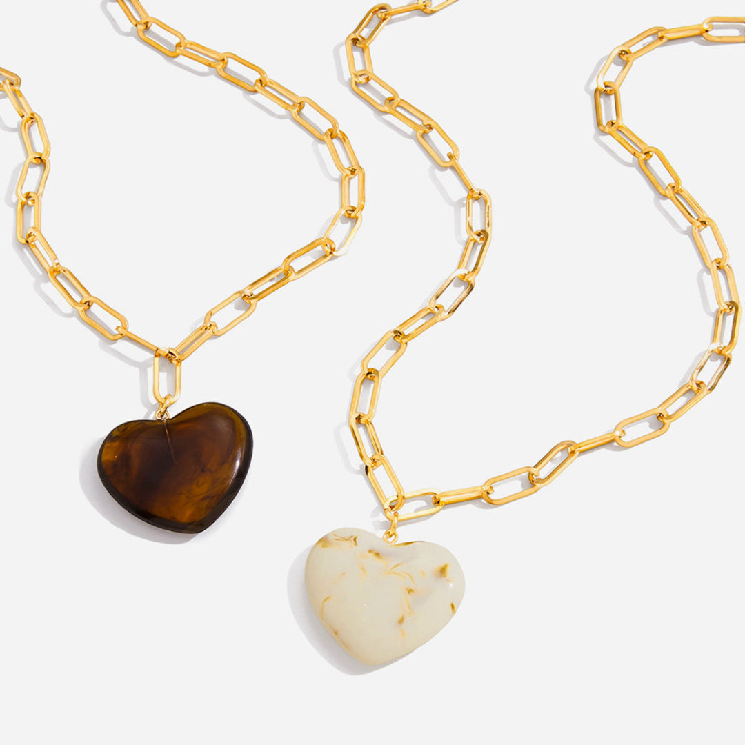 Collier cœur TOURNOYANT en acier doré