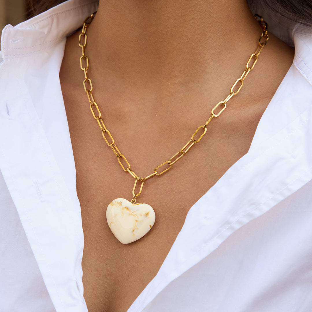 Collier cœur TOURNOYANT en acier doré